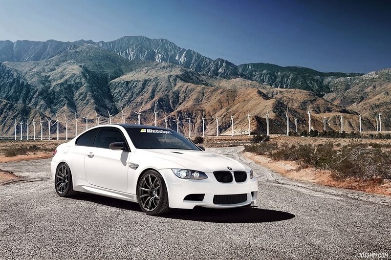 White BMW M3 in desert landscape
