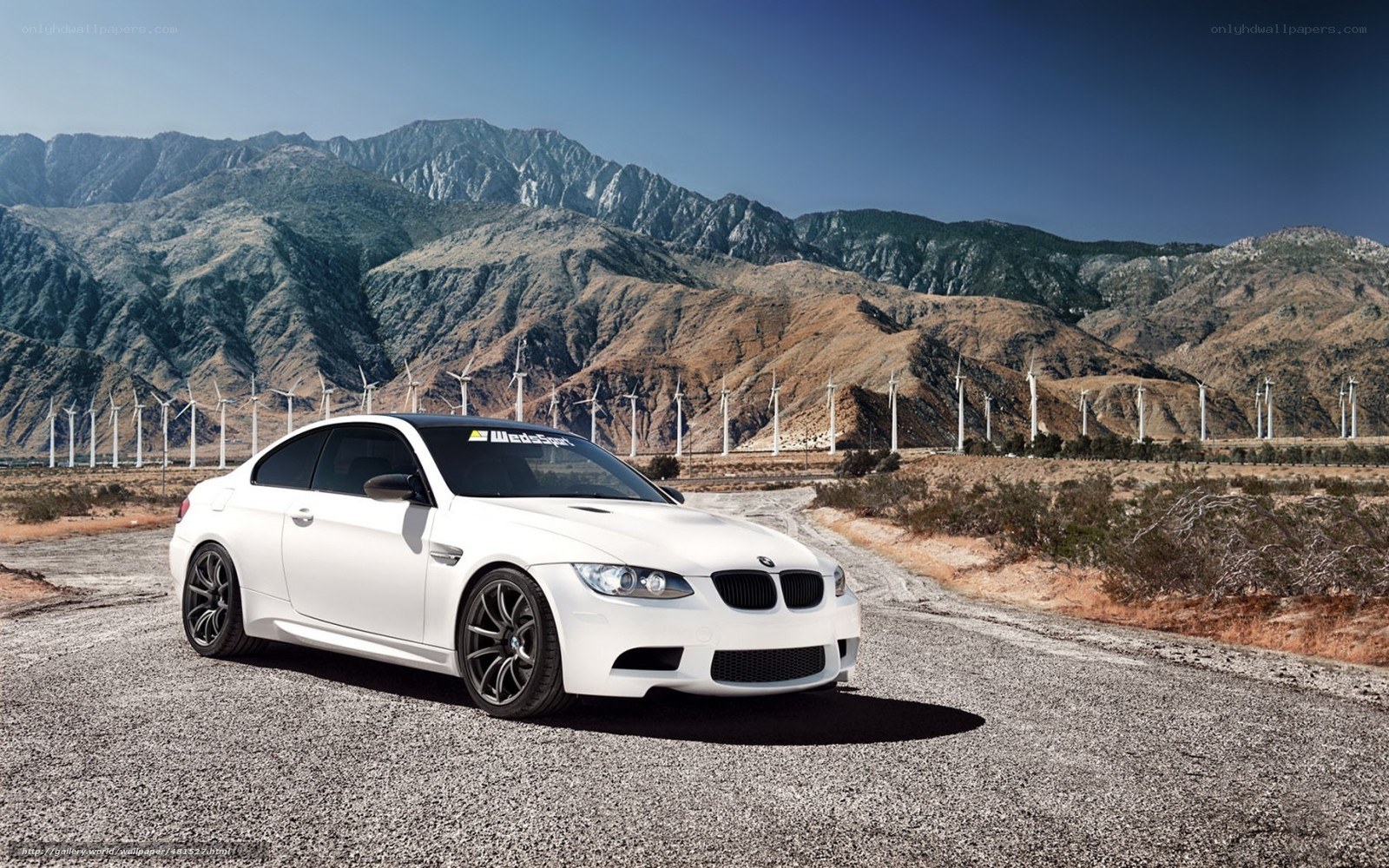 White BMW M3 in desert landscape