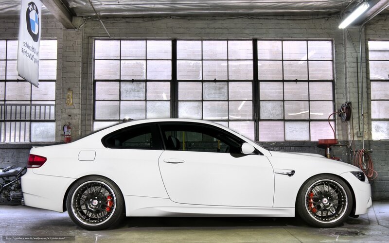 white bmw m3 in garage