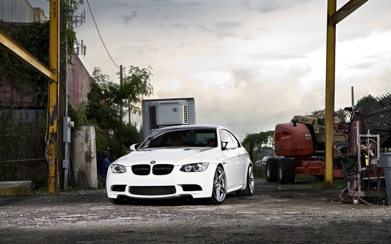 White BMW M3 in industrial lot