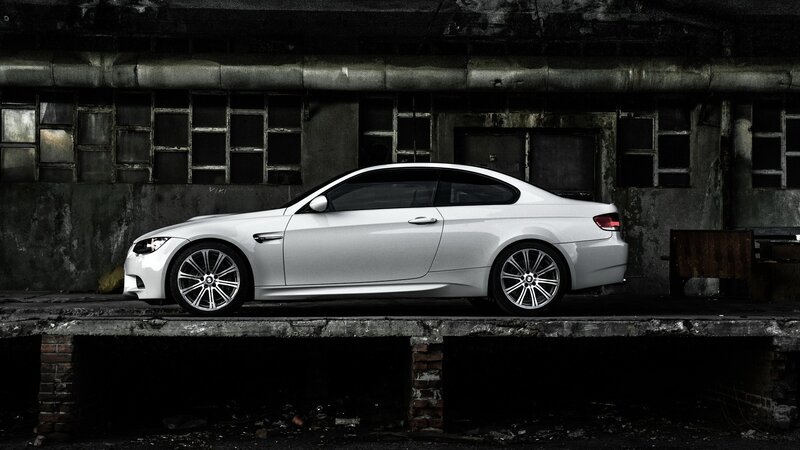 White BMW M3 in industrial setting
