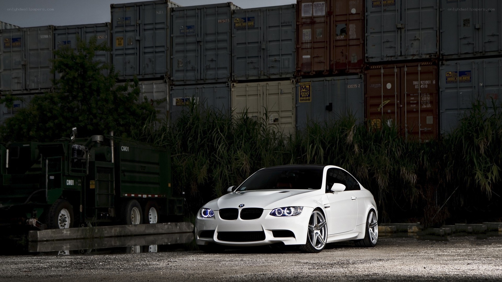 White BMW M3 in industrial setting
