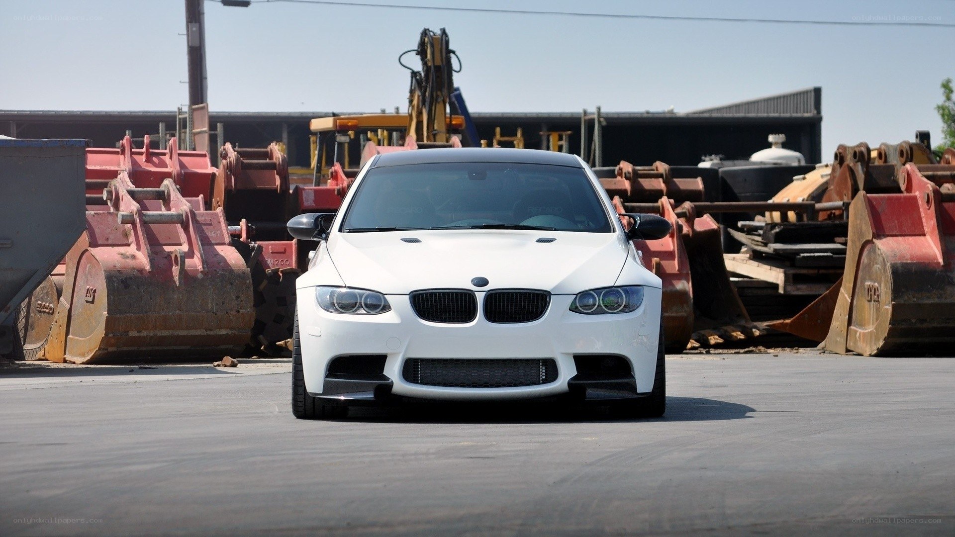 white bmw m3 in junkyard