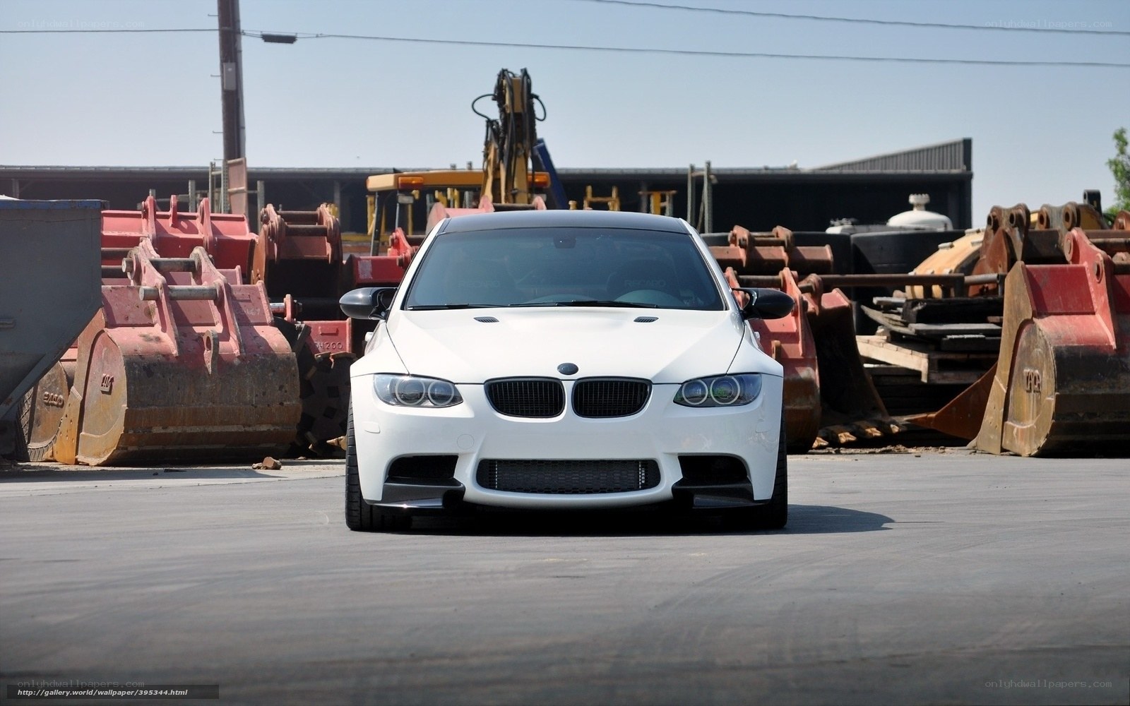 white bmw m3 in junkyard