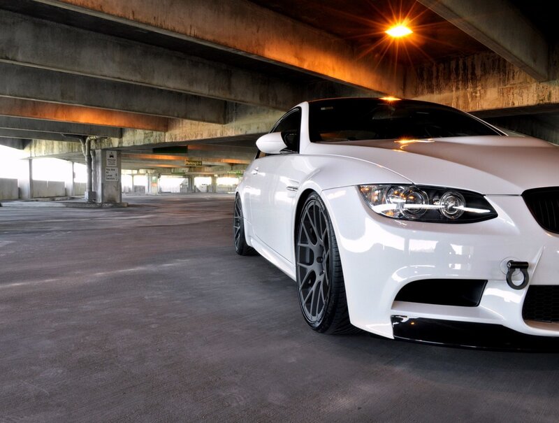 white bmw m3 in parking garage