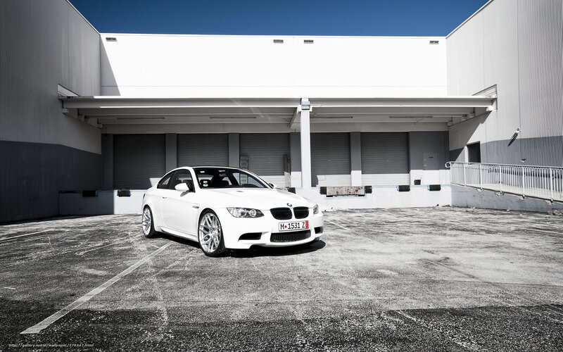 White BMW M3 in parking lot