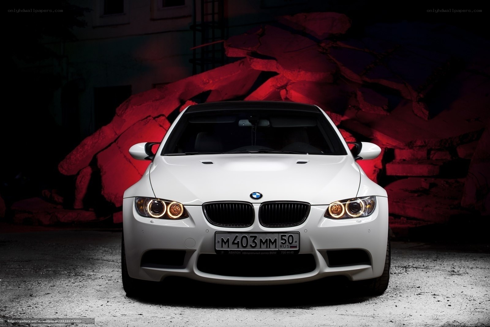 White BMW M3 in red light