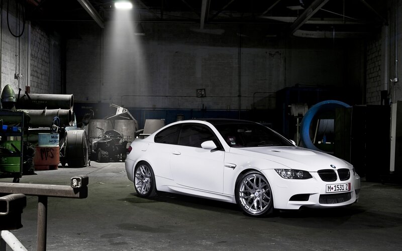 white bmw m3 in warehouse