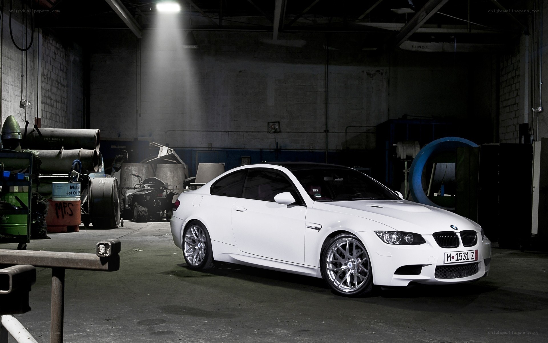 white bmw m3 in warehouse