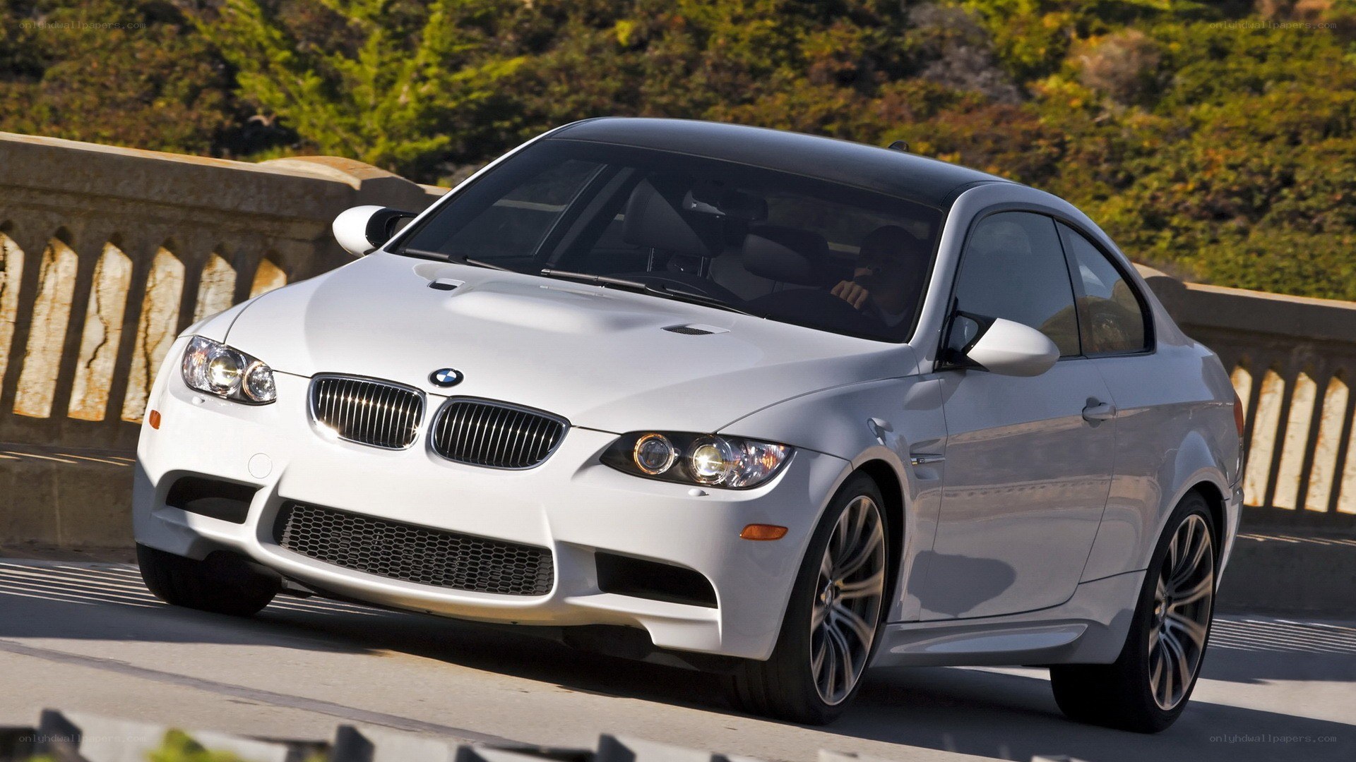 White BMW M3 on a bridge