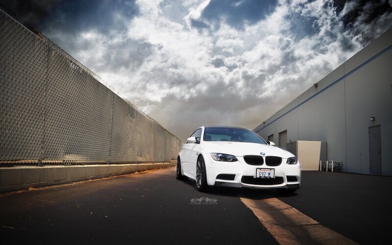 White BMW M3 on a cloudy day