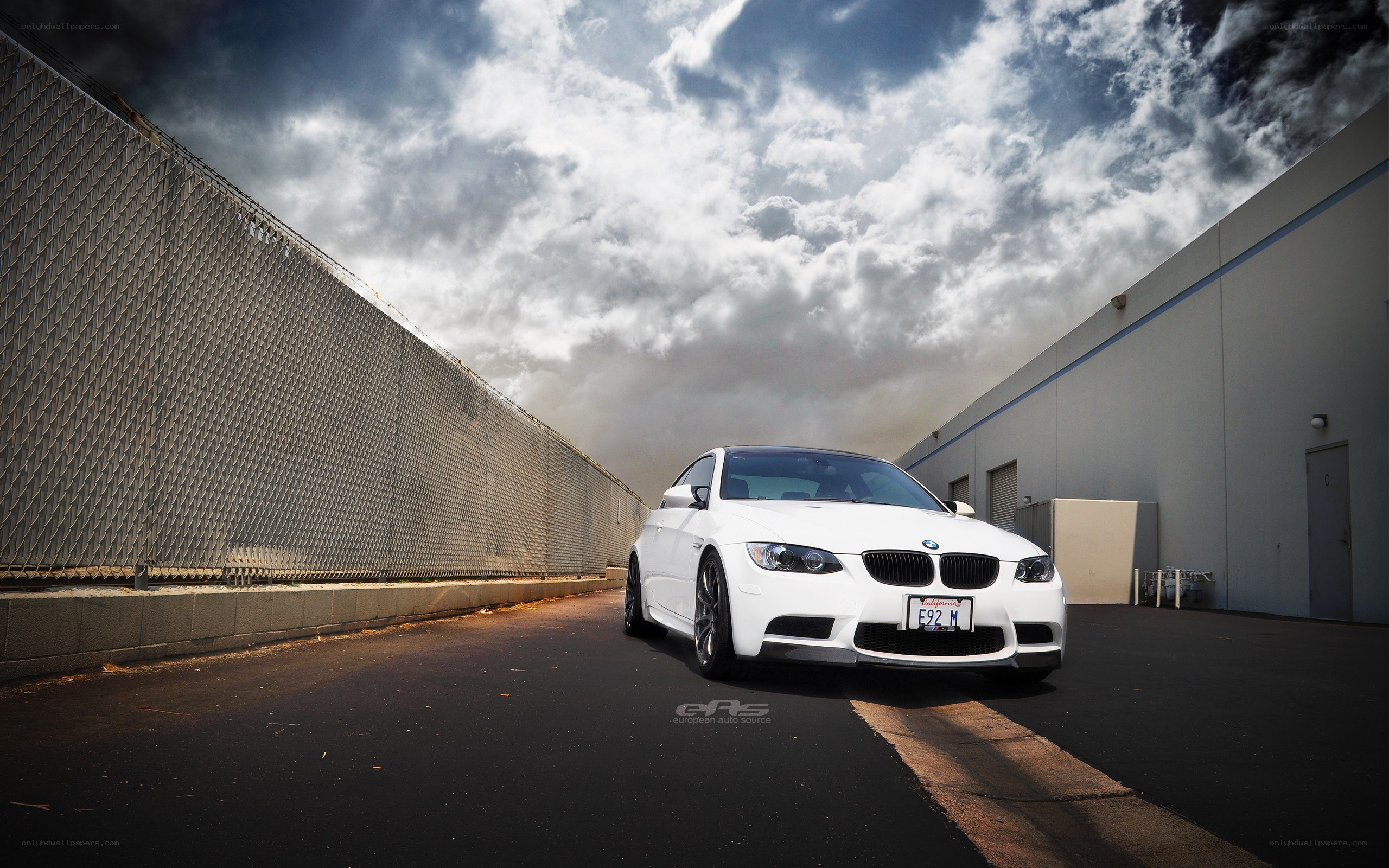 White BMW M3 on a cloudy day