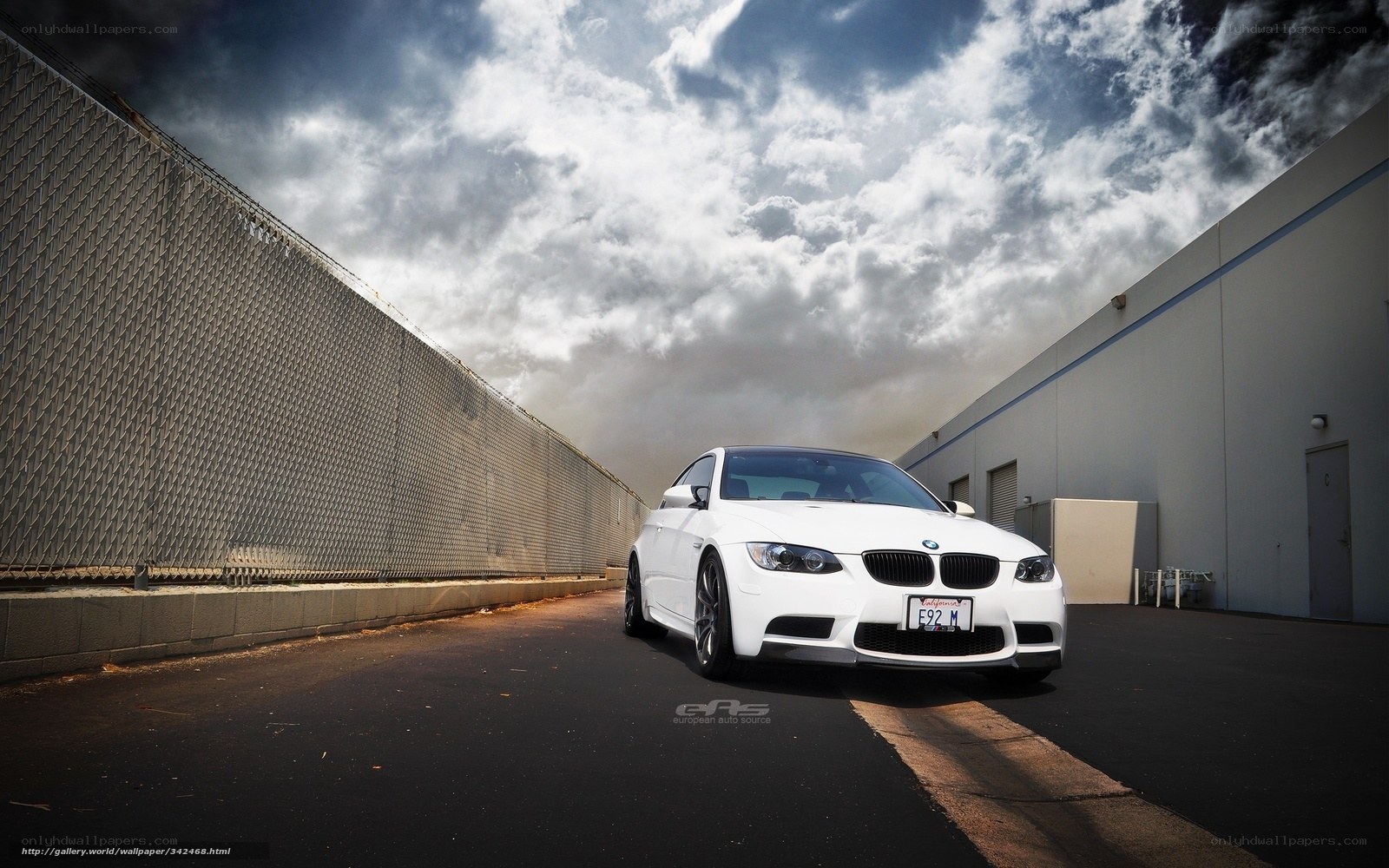 White BMW M3 on a cloudy day
