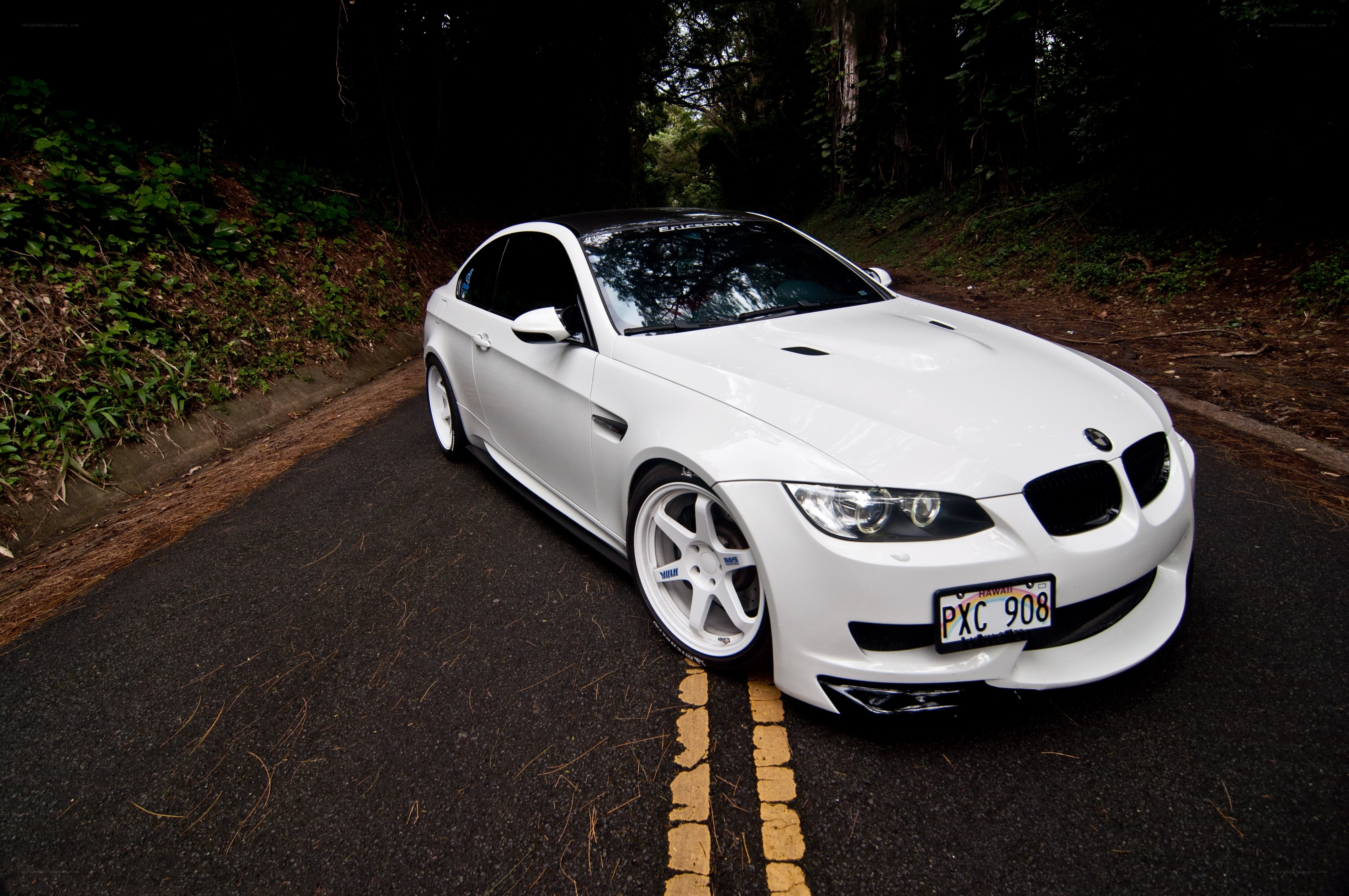White BMW M3 on a forest road