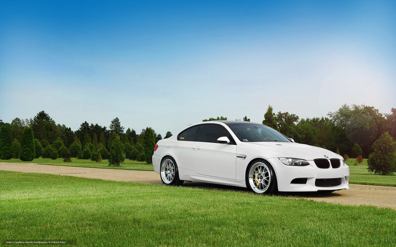 White BMW M3 on a grassy field