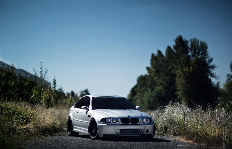 White BMW M3 on a gravel road