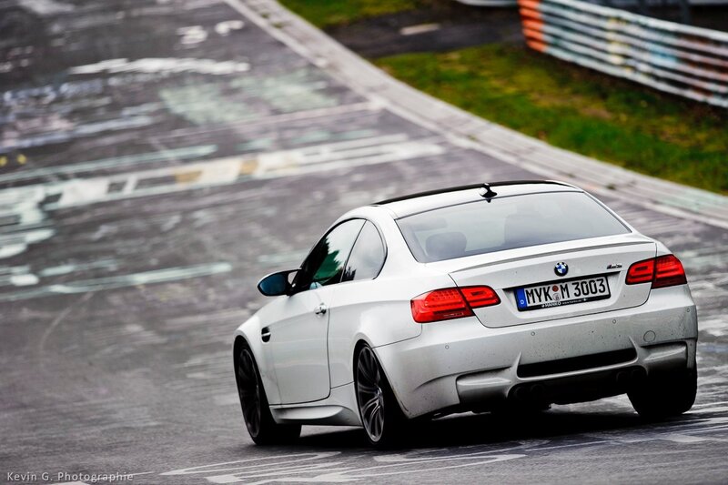 White BMW M3 on a racetrack
