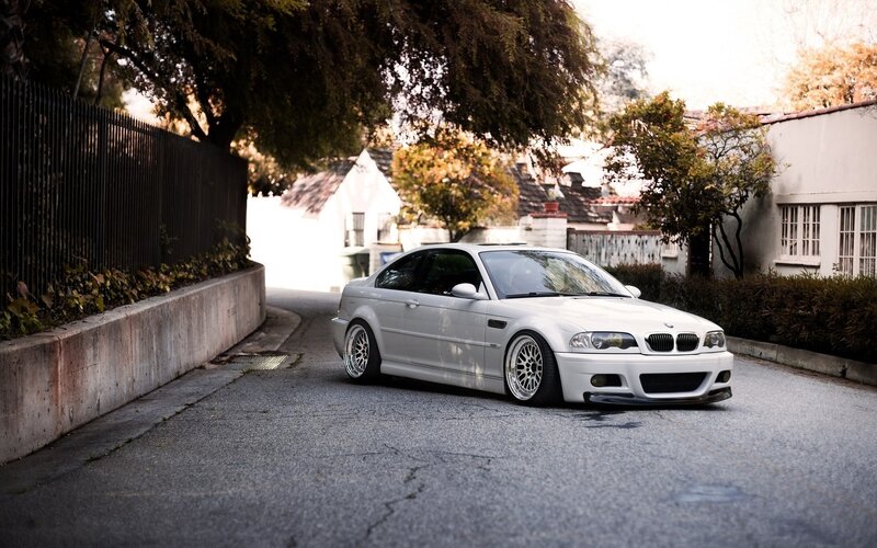 white bmw m3 on a residential street