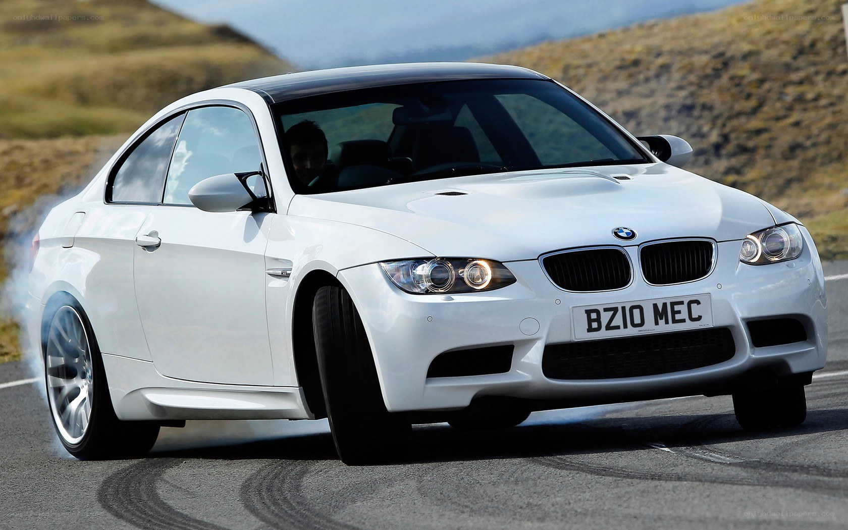 white bmw m3 on a road