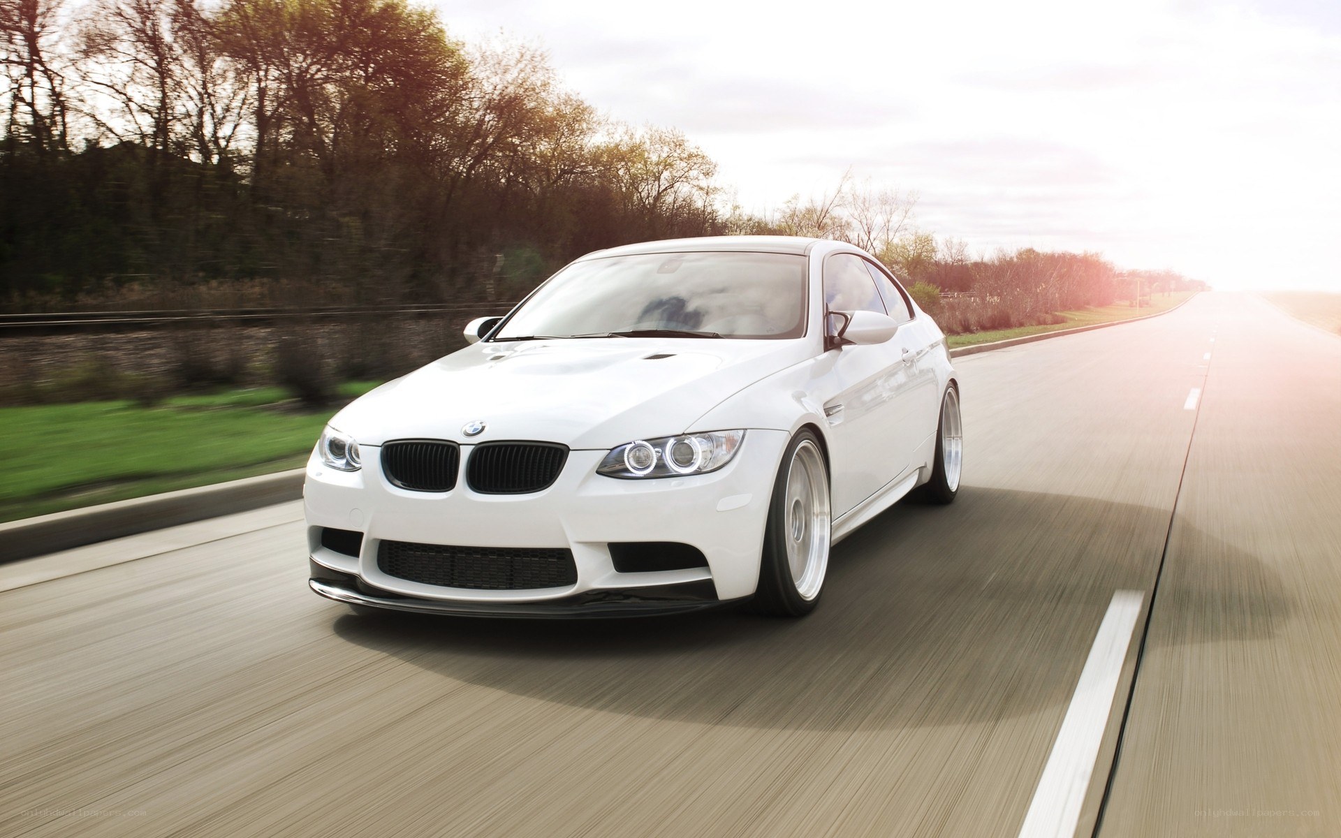white bmw m3 on a road