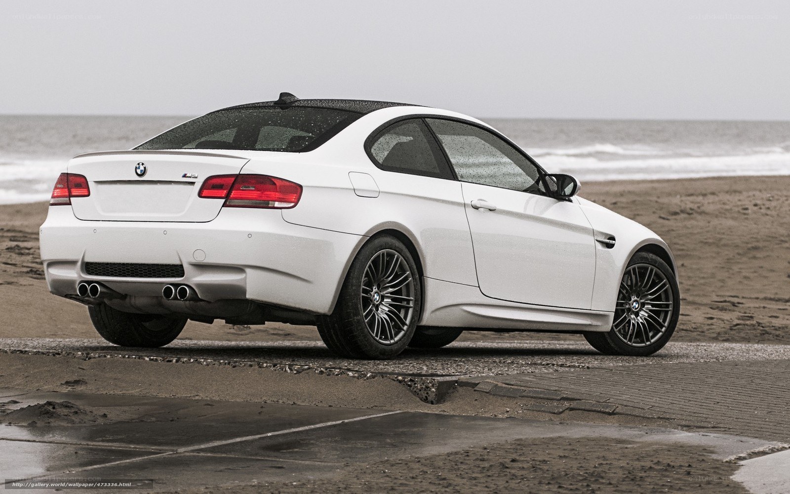 white bmw m3 on beach