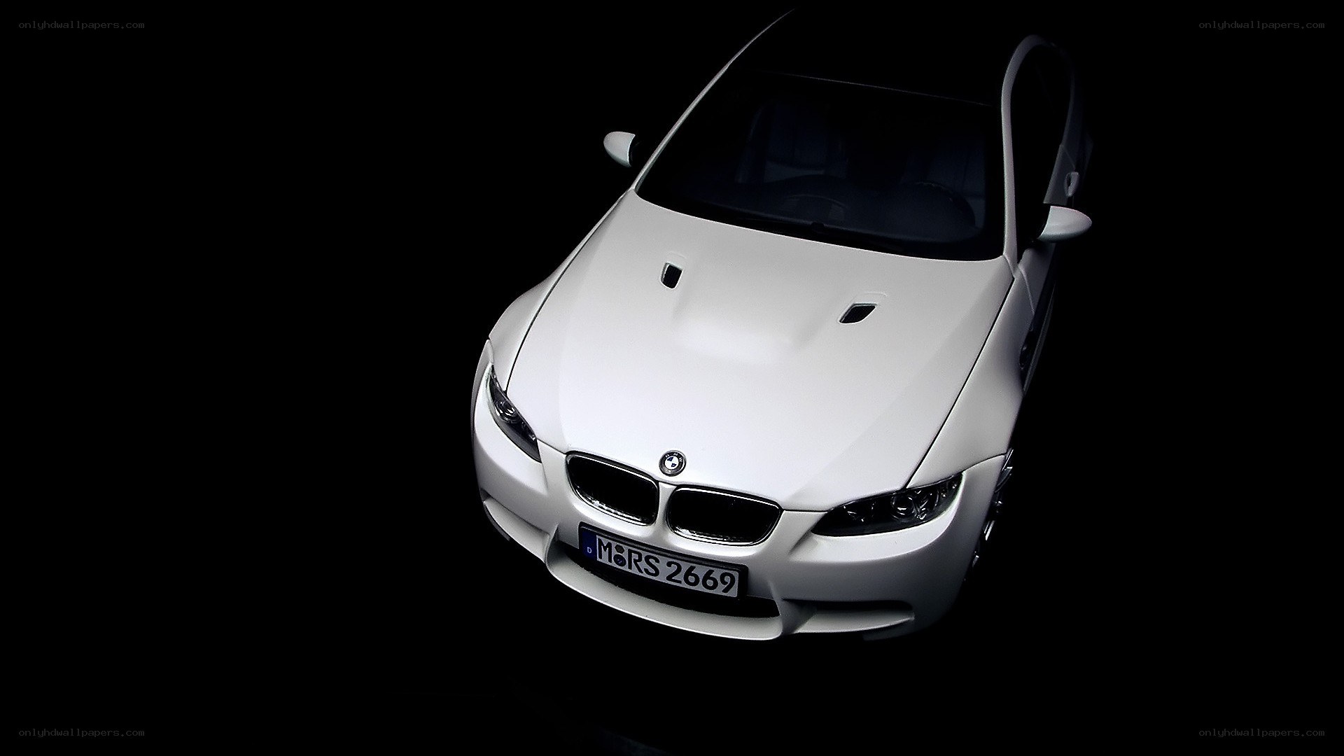 white bmw m3 on black background