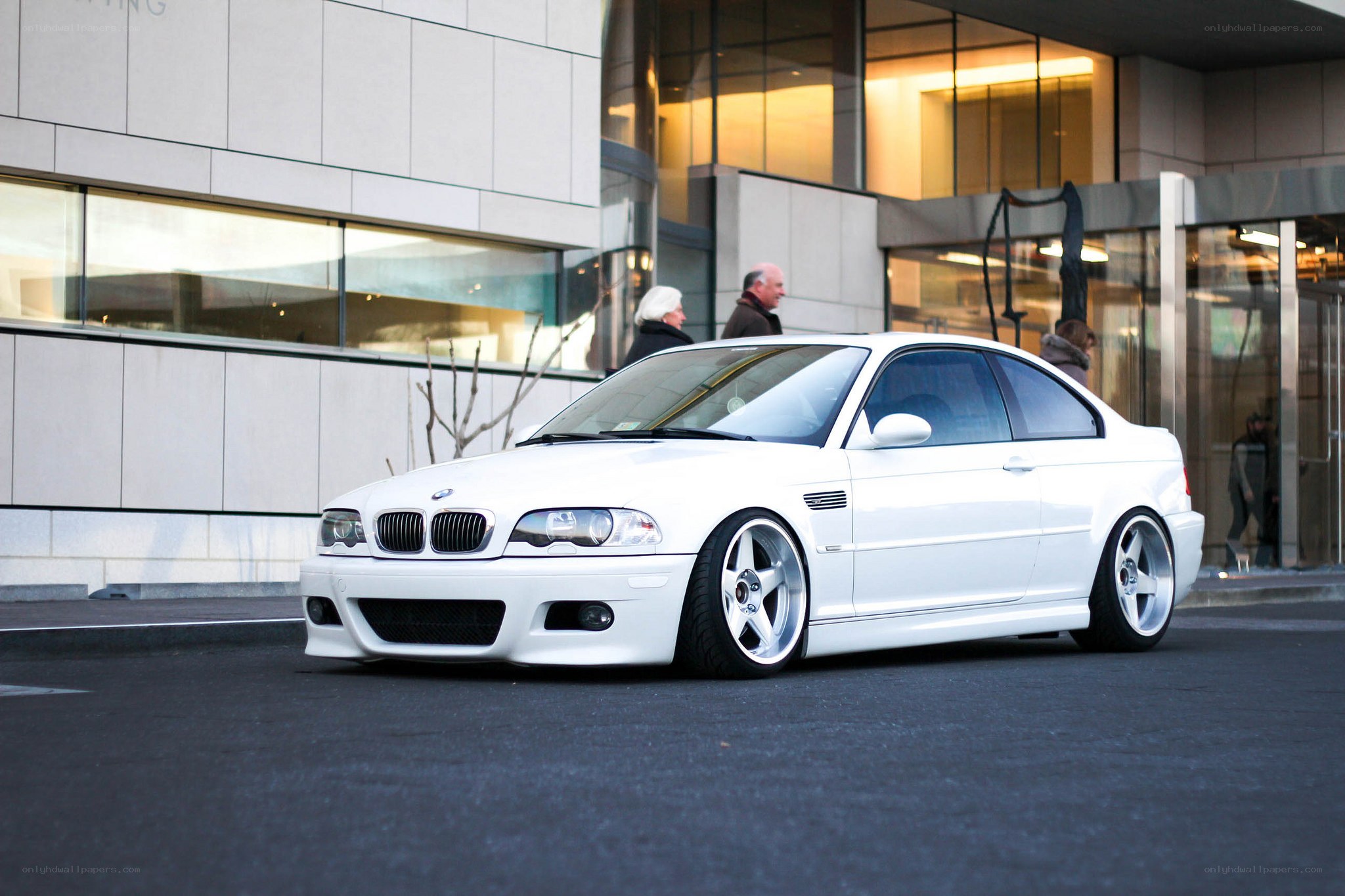 White BMW M3 on city street