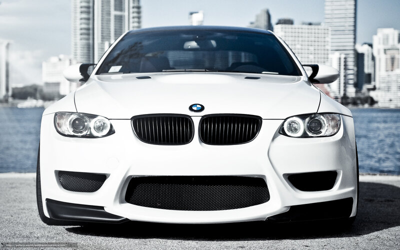 White BMW M3 on city waterfront