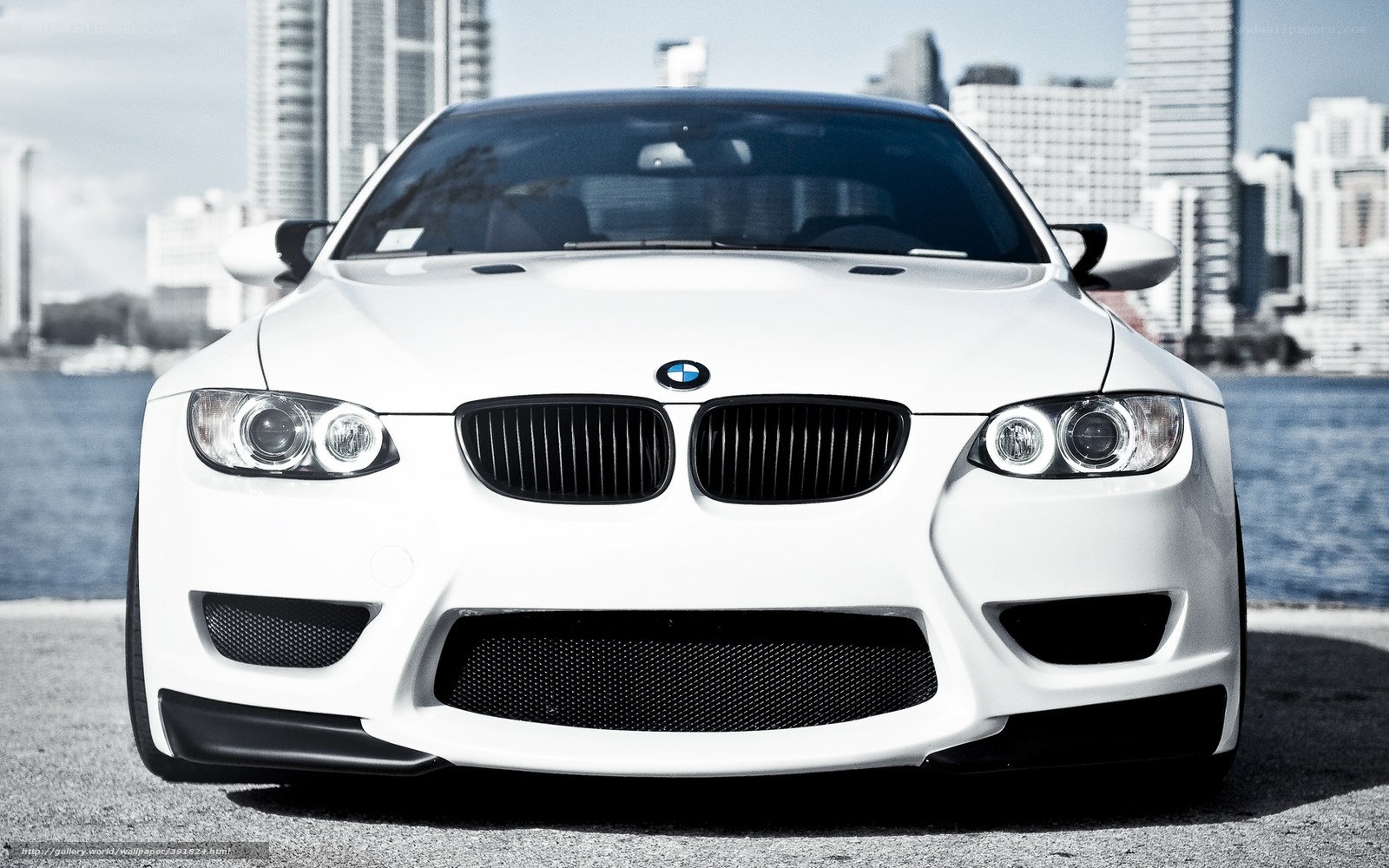 White BMW M3 on city waterfront