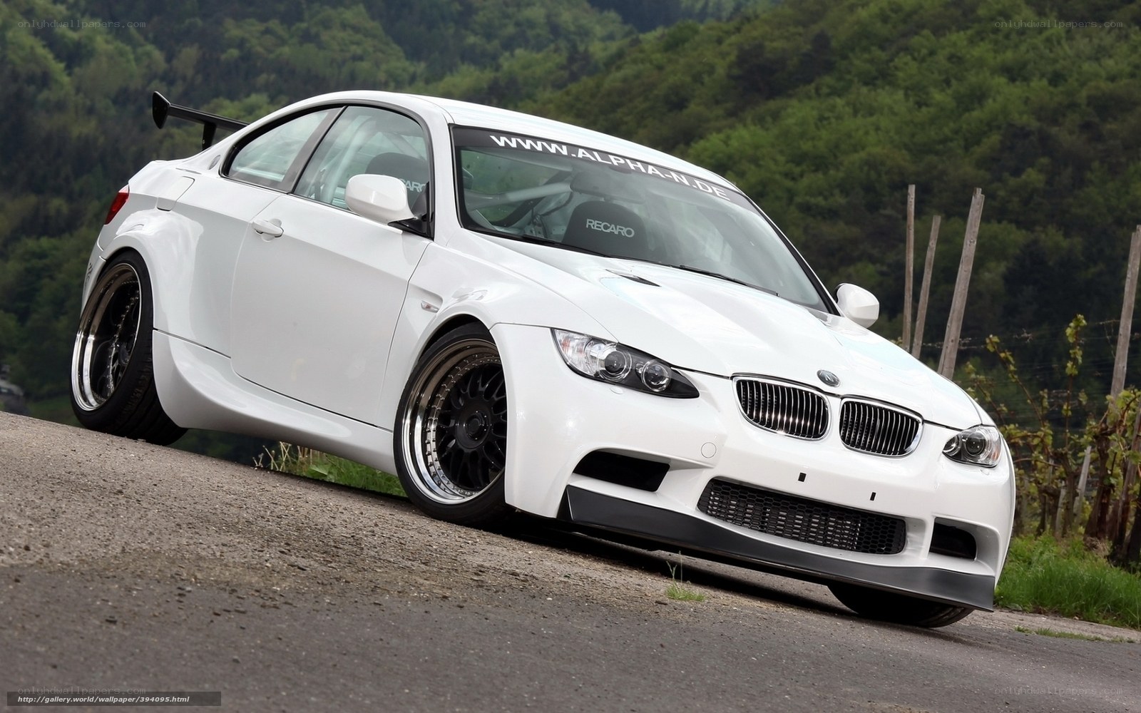 white bmw m3 on country road