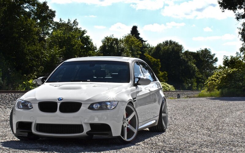 white bmw m3 on gravel