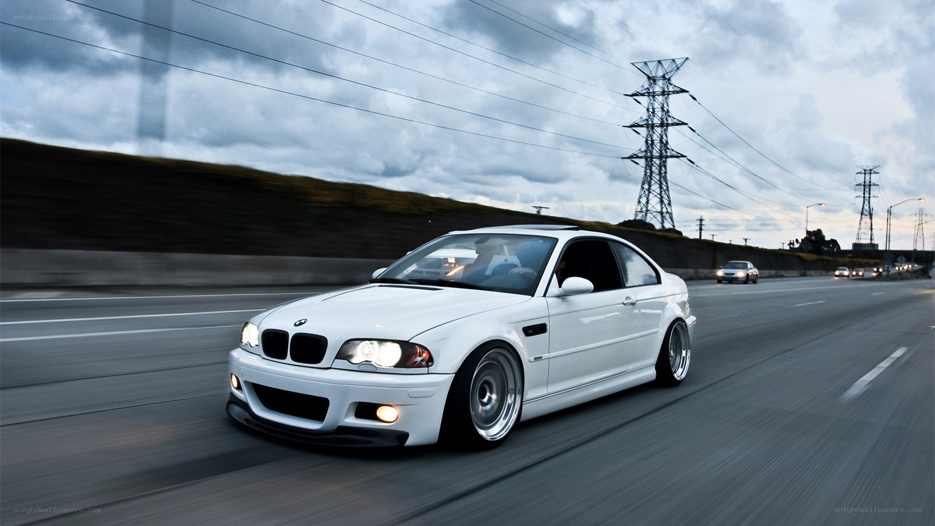 white bmw m3 on highway