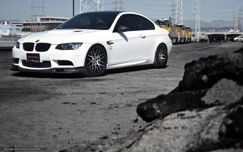white bmw m3 on industrial lot