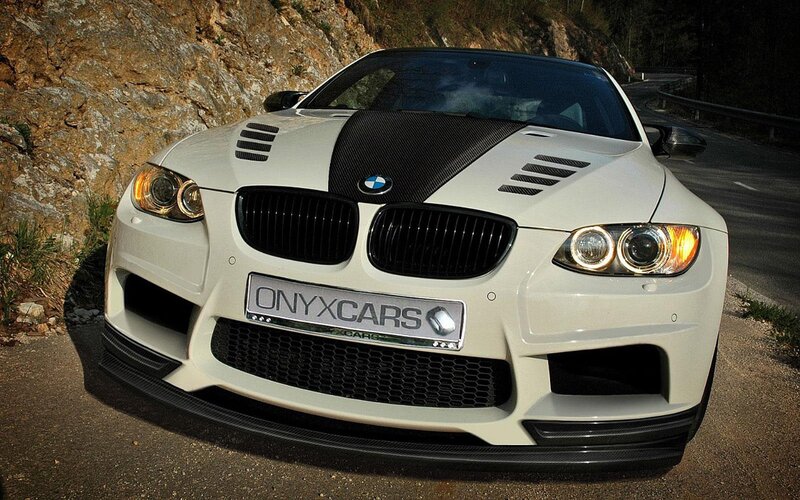 white bmw m3 on mountain road