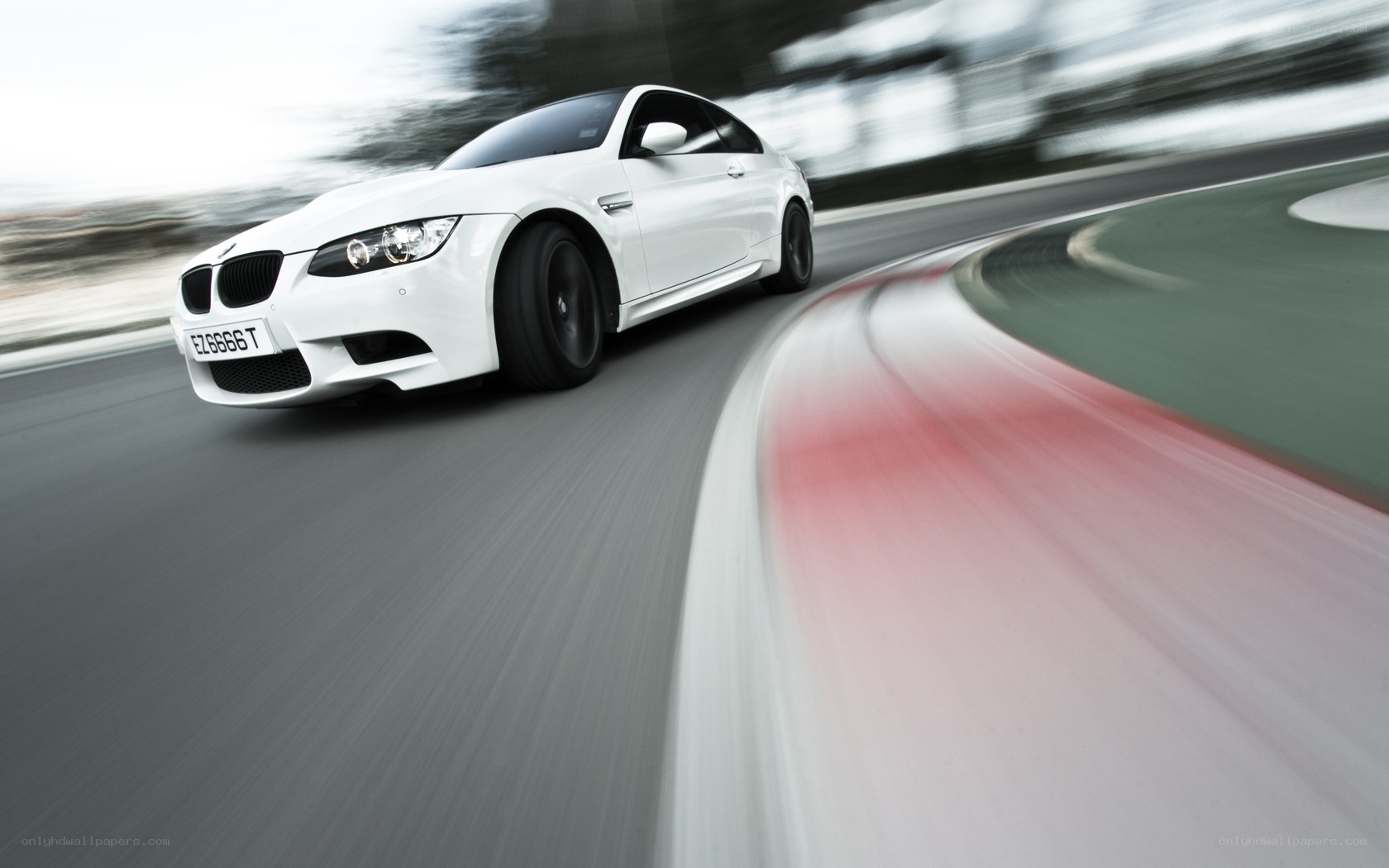White BMW M3 on racetrack