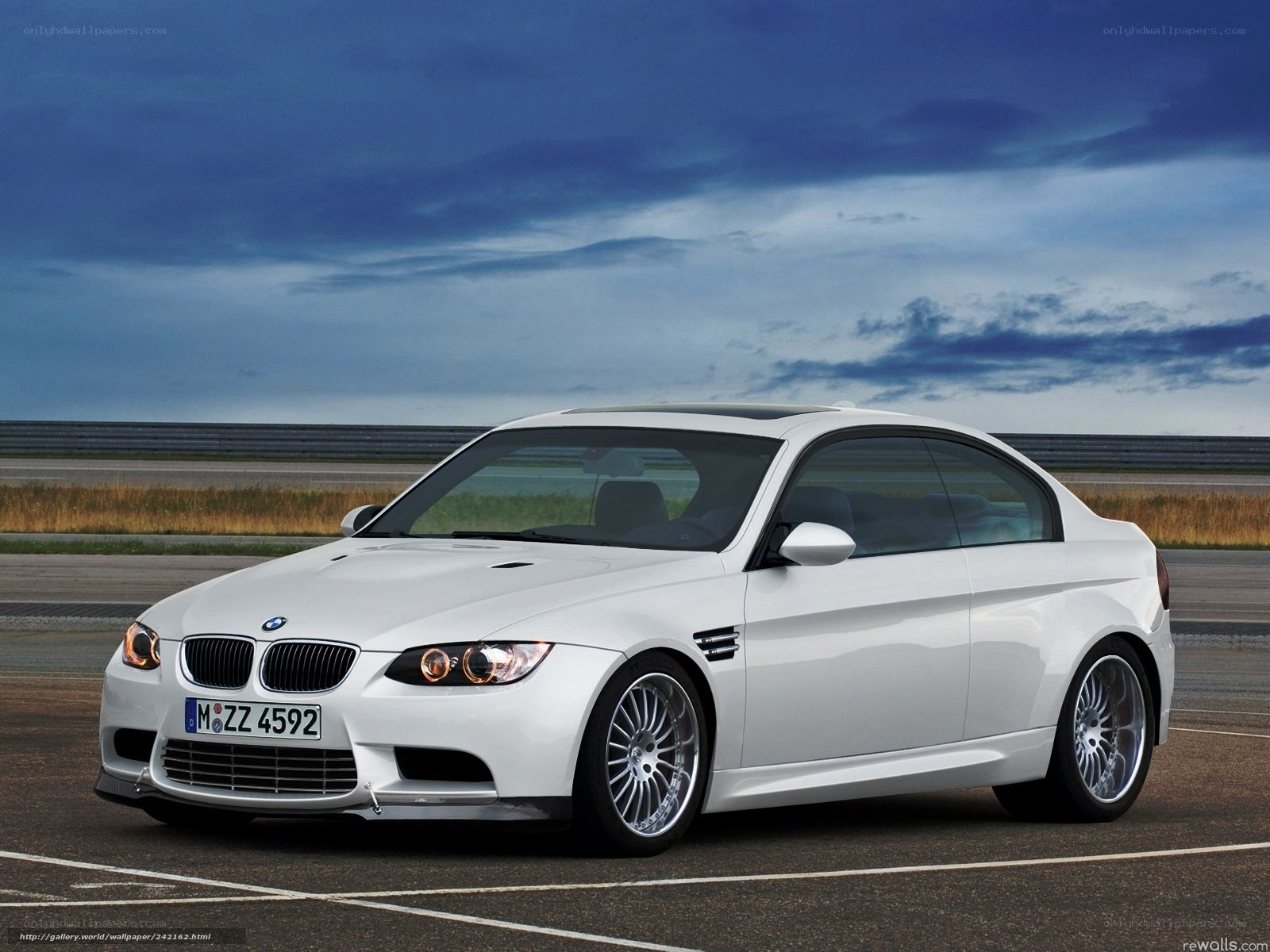 White BMW M3 on racetrack
