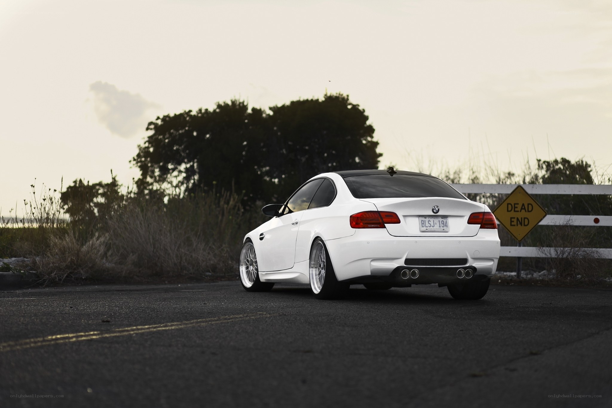 white bmw m3 on road