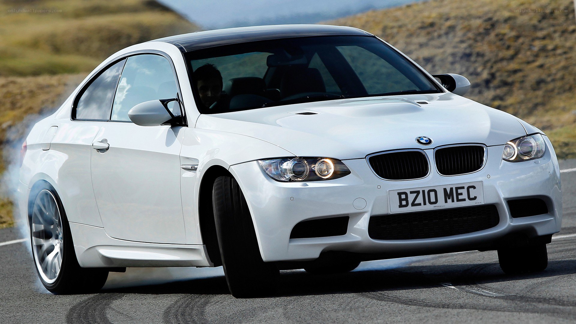 white bmw m3 on road