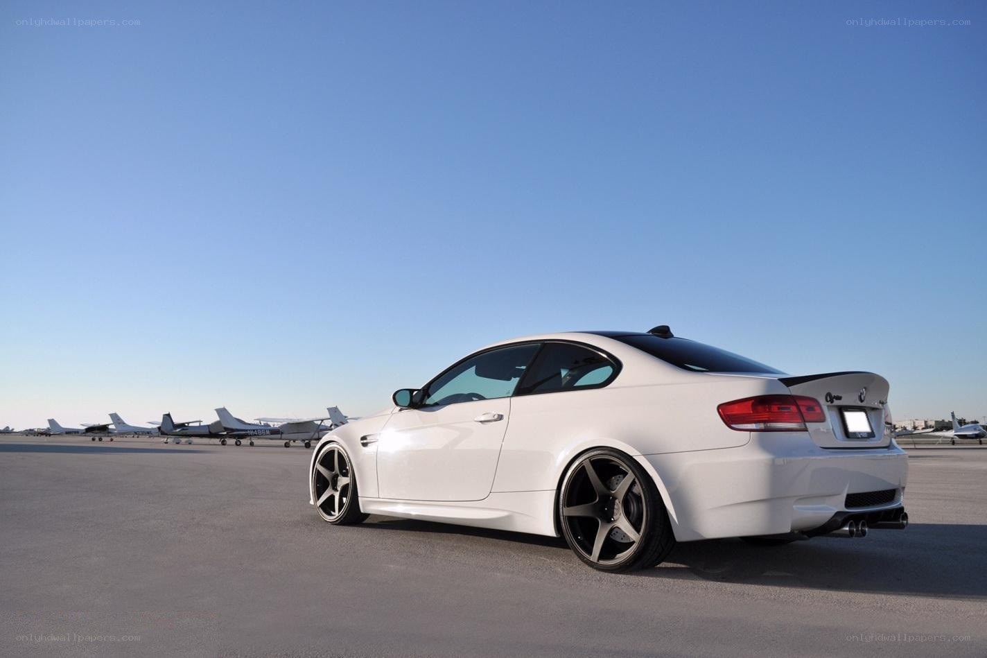 white bmw m3 on tarmac