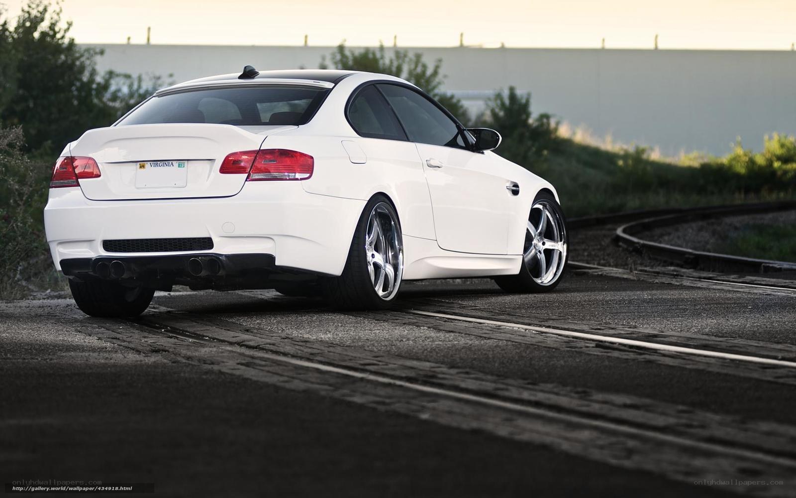white bmw m3 on train tracks