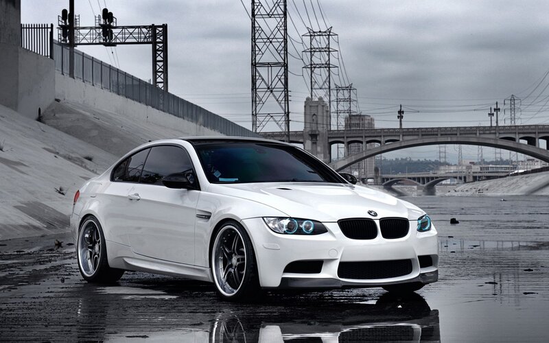 white bmw m3 on wet pavement