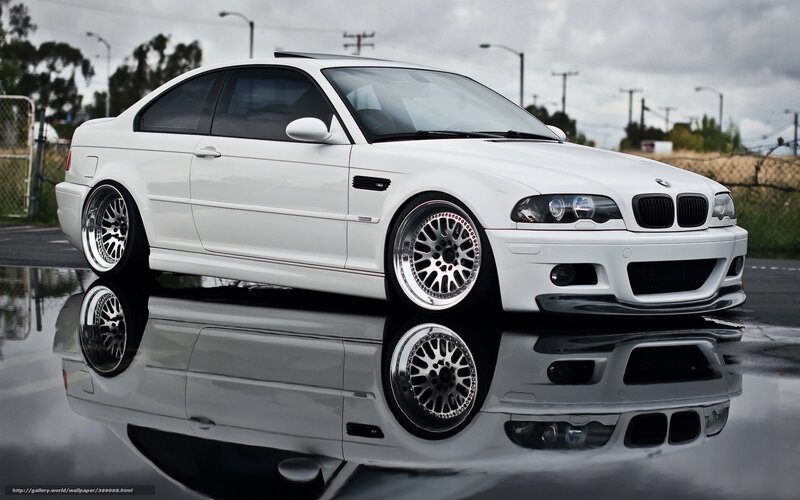 white bmw m3 on wet pavement