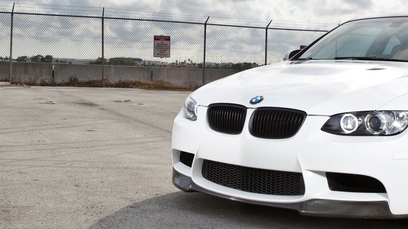 white bmw m3 parked in lot