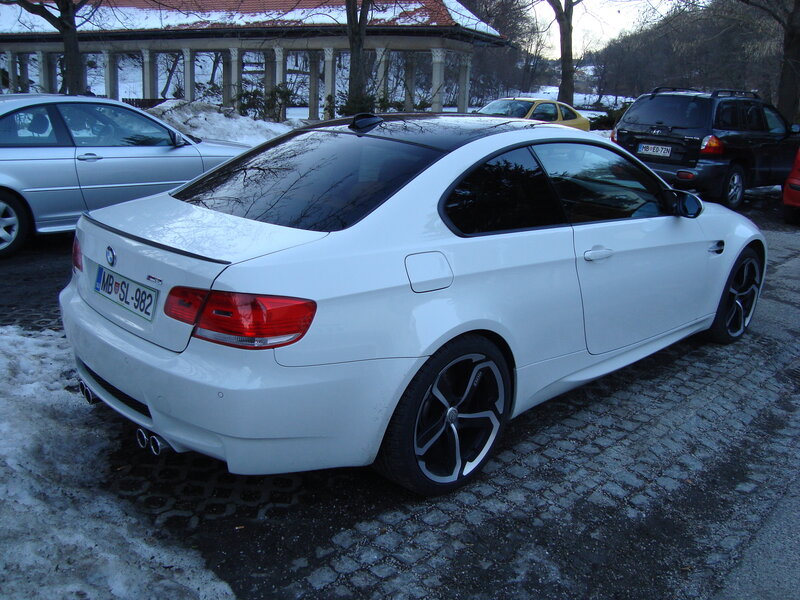 White BMW M3 parked in snow