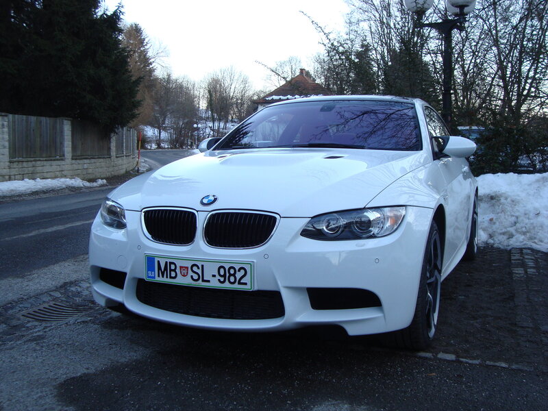 white bmw m3 parked on street