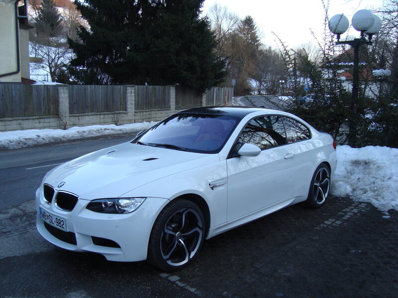White BMW M3 parked on street