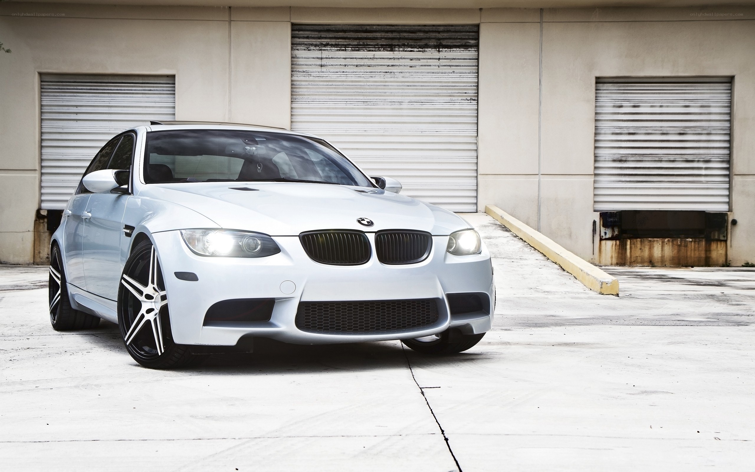 white bmw m3 parked outside