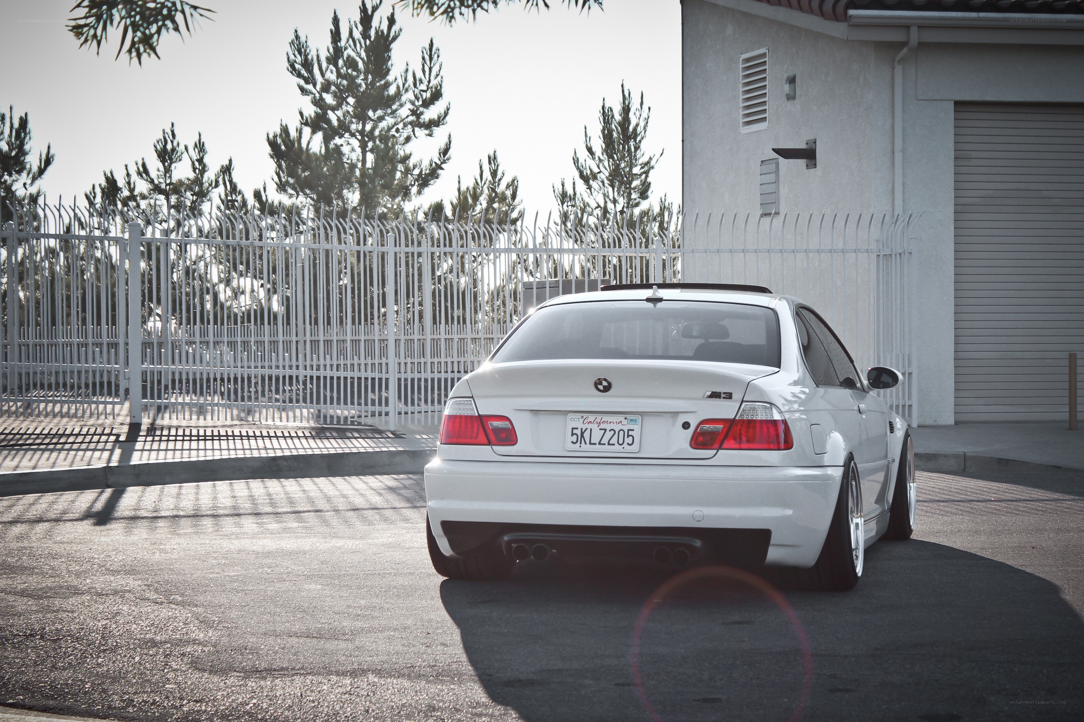 white bmw m3 parked outside