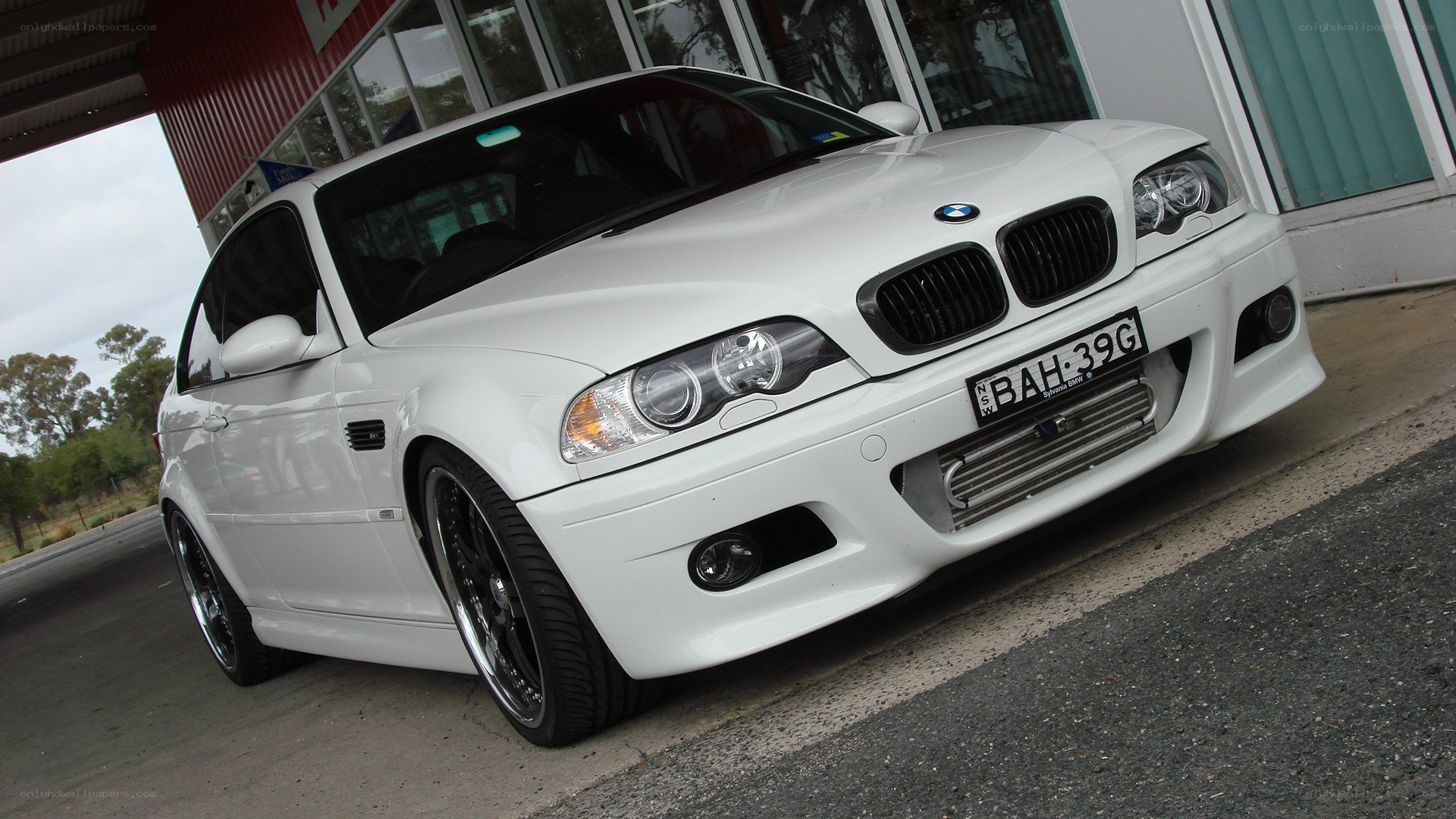 white bmw m3 parked outside