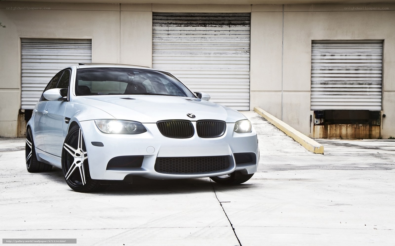 white bmw m3 parked outside